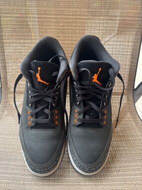 Jordan Black Sneakers with Orange Jumpman Accents